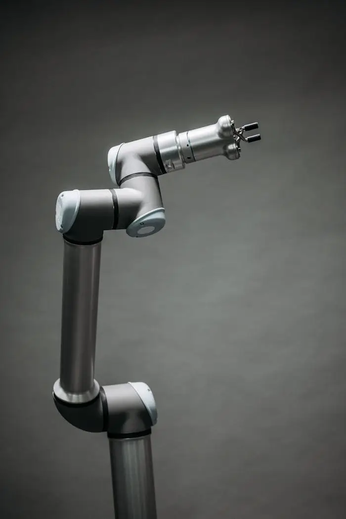 The Art of Drawing Readers In: Your attractive post title goes here An industrial robotic arm on a neutral background, showcasing modern technology and innovation.